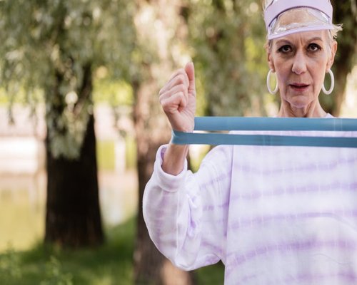 Active elderly person exercising outdoors in a park